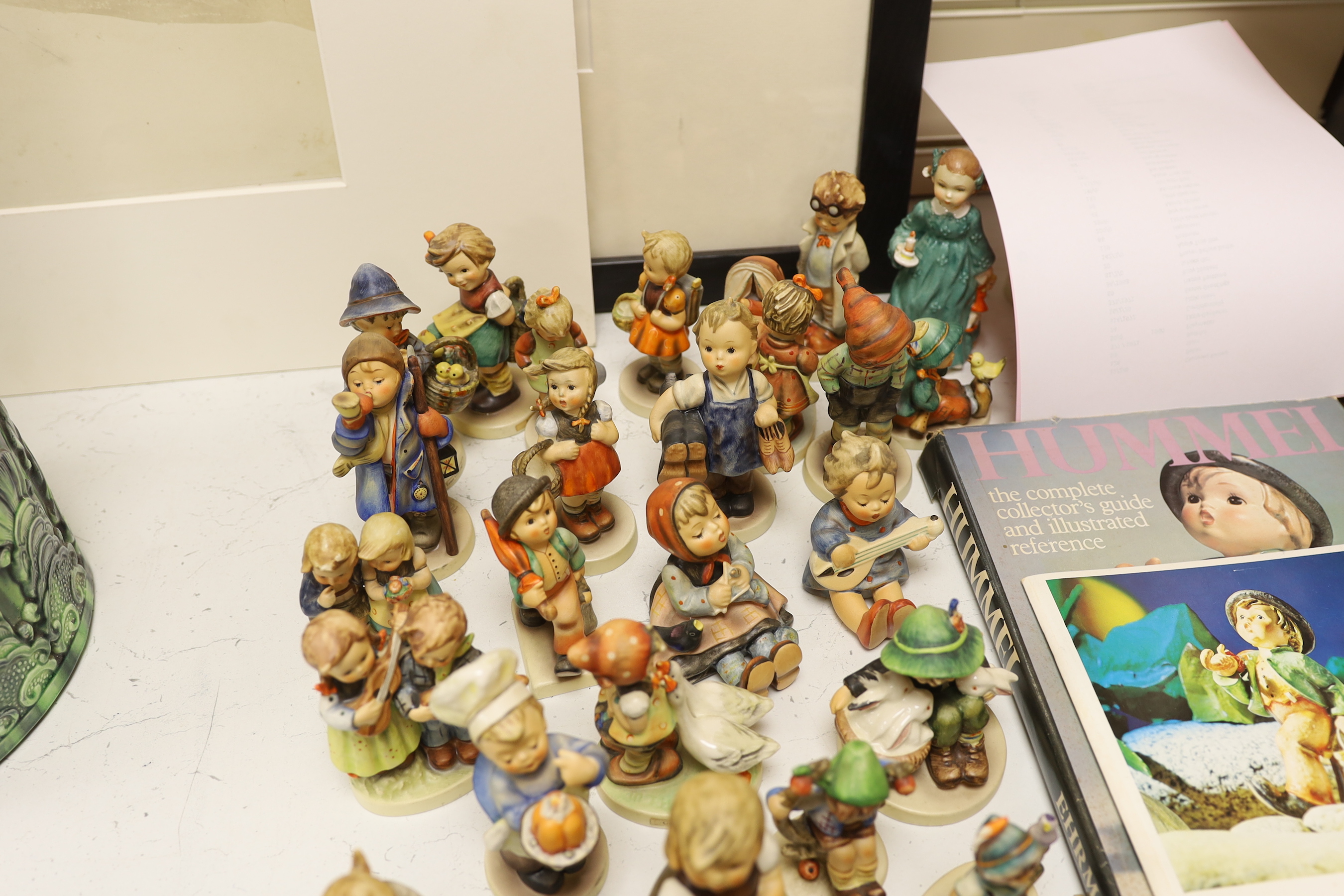 A collection of Hummel / Goebel figures